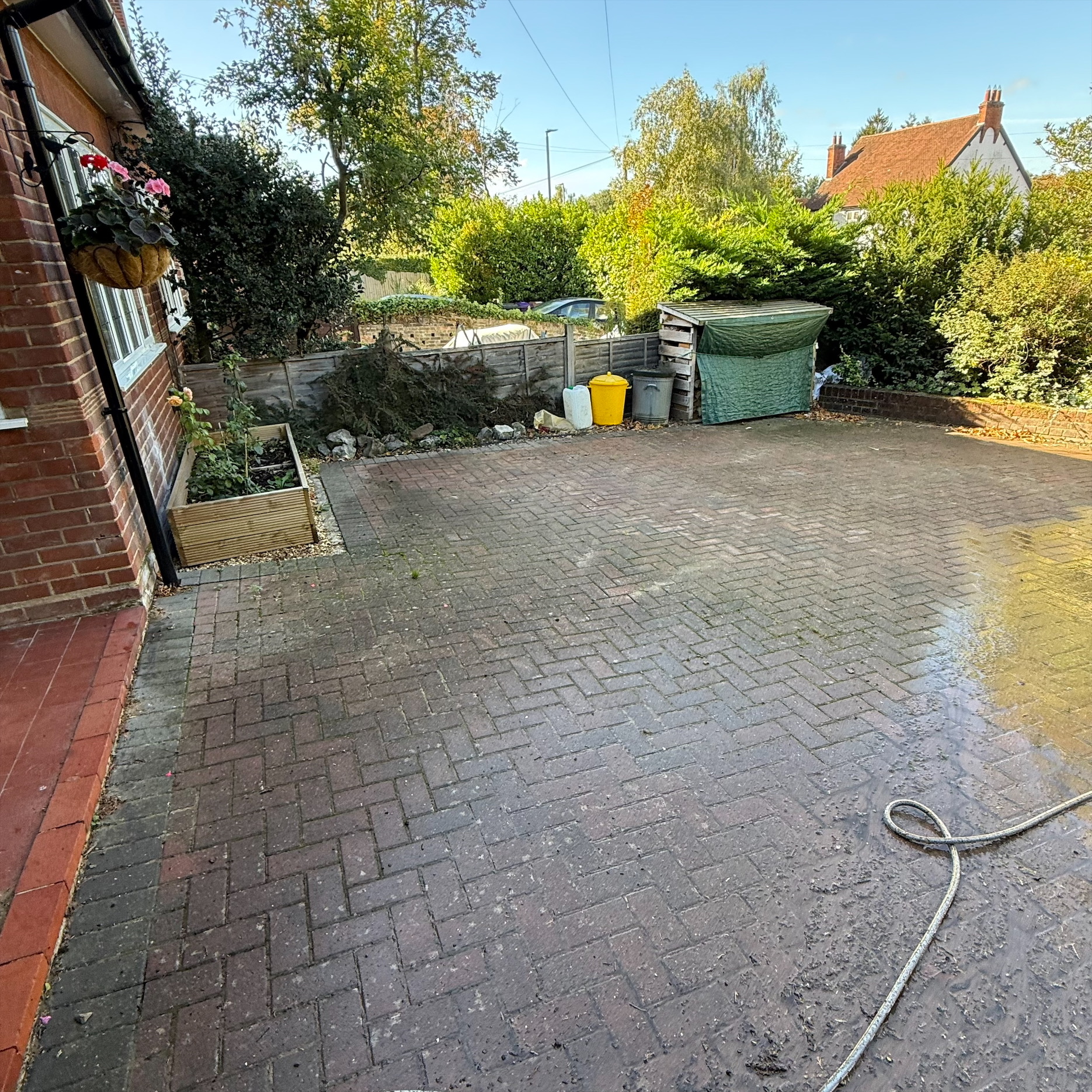 Weathered garden decking before professional exterior maintenance cleaning in Welwyn Hertfordshire